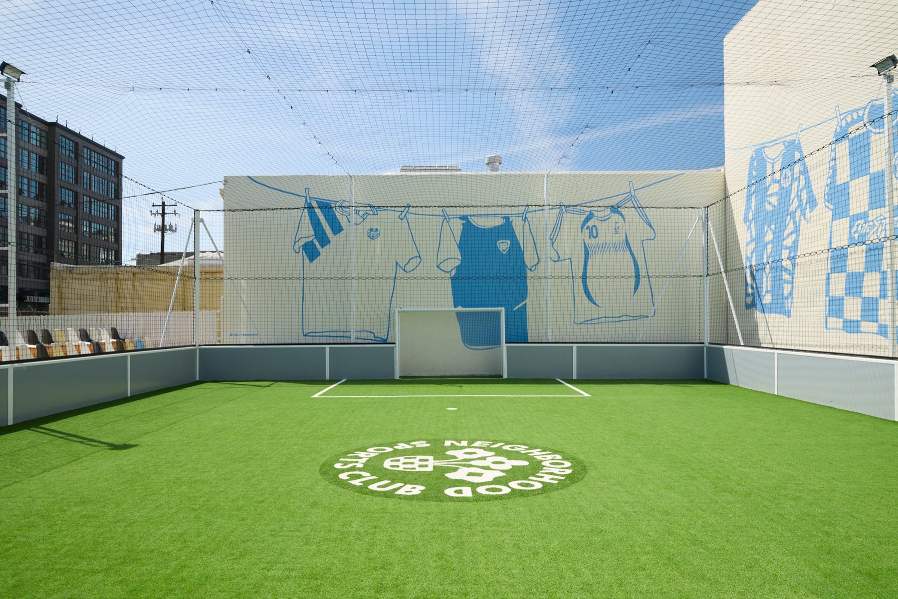 The pitch at Neighborhood Sports Club, crest at centre circle